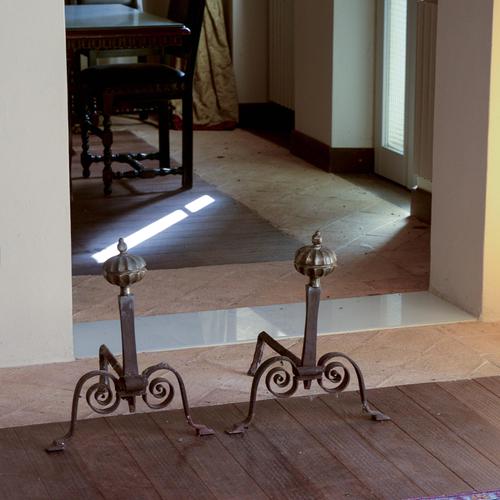 This pair of antique andirons is a striking decorative and functional addition to your fireplace. Crafted from forged...