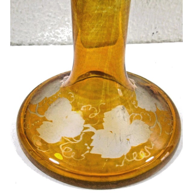 This is a medium-sized Bohemian amber compote cut crystal featuring an engraved country scene of deer, typical of 19th-...