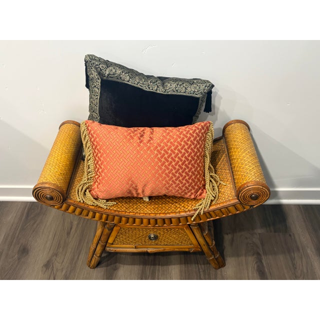 Scrolled woven bamboo arms, woven cane seat, built in central drawer and two decorative pillows create this " Curele...