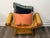 Scrolled woven bamboo arms, woven cane seat, built in central drawer and two decorative pillows create this " Curele...