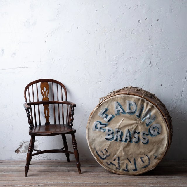 Round brass drum with blue text reading "J.B. Treat Reading Brass Band" around the rim, c.1860s.