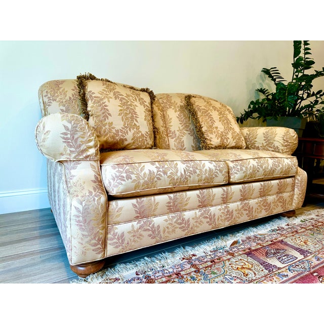 Upgrade your space with this rare, one-of-a-kind matching pair of vintage custom-made loveseats from Ethan Allen, a brand...
