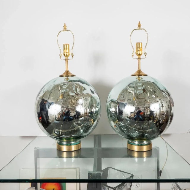 Pair of spherical mercury glass table lamps with blue tint.