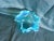 Description: Vintage aqua-blue art glass rose bowl featuring a wide hand-ruffled/crimped rim with milky white opalescent...