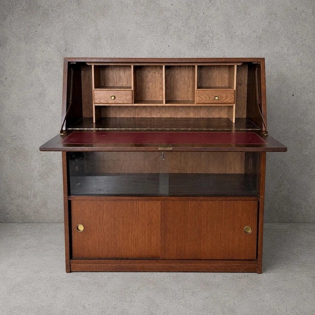 Details * Mid-century, circa 1960s–1970s * Tiger oak construction * Fall-front bureau with fitted interior * Original red...