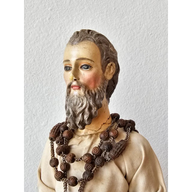 A scarce Baroque period Spanish or Italian hand carved polychrome painted wood Santo sculpture with inset colored glass...