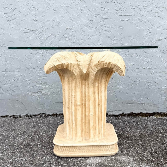 This boho chic side table brings a touch of the tropics to any corner with its sculptural banana leaf pedestal. A tall...