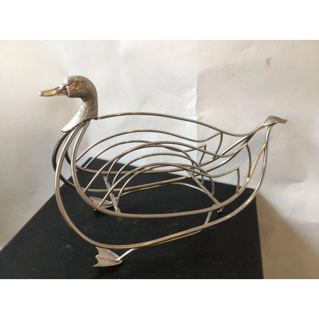 1960s Italian chrome Maison Jansen style swan magazine rack. From a Southampton, NY estate.