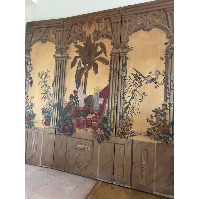 This stunning Maitland-Smith four panel screen features a tropical/jungle landscape framed with neoclassical columns and...