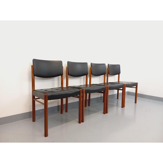 4 vintage Scandinavian style chairs in solid teak and black skai from the 60s, very good general condition. Wide and...
