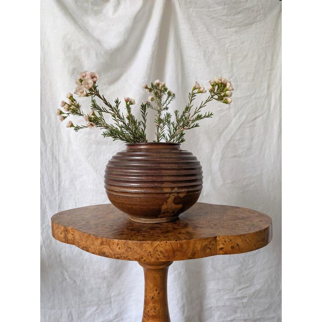 Vintage brutalist style ceramic globe vase with concentric horizontal ridges in the manner of mid century modern designer...