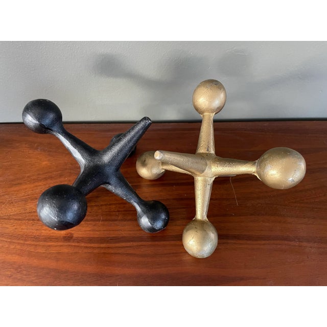 Pair of vintage metal Jax Jacks Bookends. Black and gold. Original finish with wear consistent with age. 6” Attributed to...
