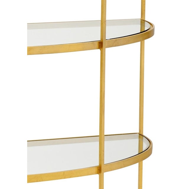 Iron etagere with antique gold leaf finish, clear glass shelves 82.5h x 49w x 21.5d