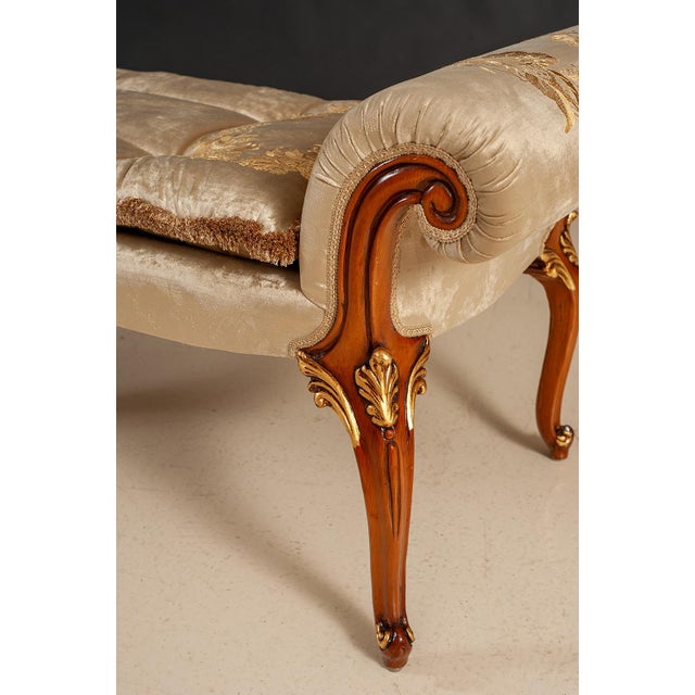 Handcrafted in Italy, this elegant bench features a solid wood frame with hand-carved details and a warm walnut finish...