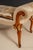 Handcrafted in Italy, this elegant bench features a solid wood frame with hand-carved details and a warm walnut finish...