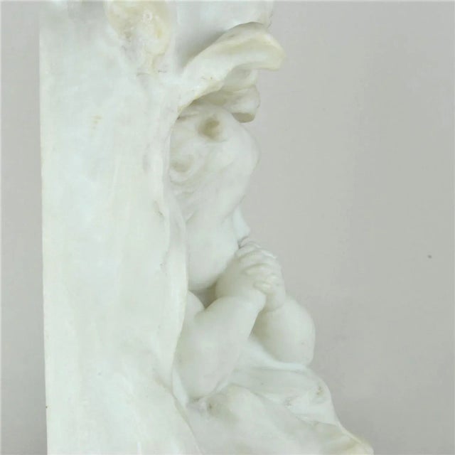 Nice marble sculpture of a baby with joined hands, signed by the artist E Fortiny (active from 1870 to 1920) Nice...