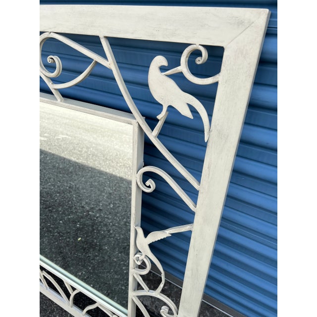 White Metal Mirror by Ballard Designs . Birds Adorn around the Metal Frame .