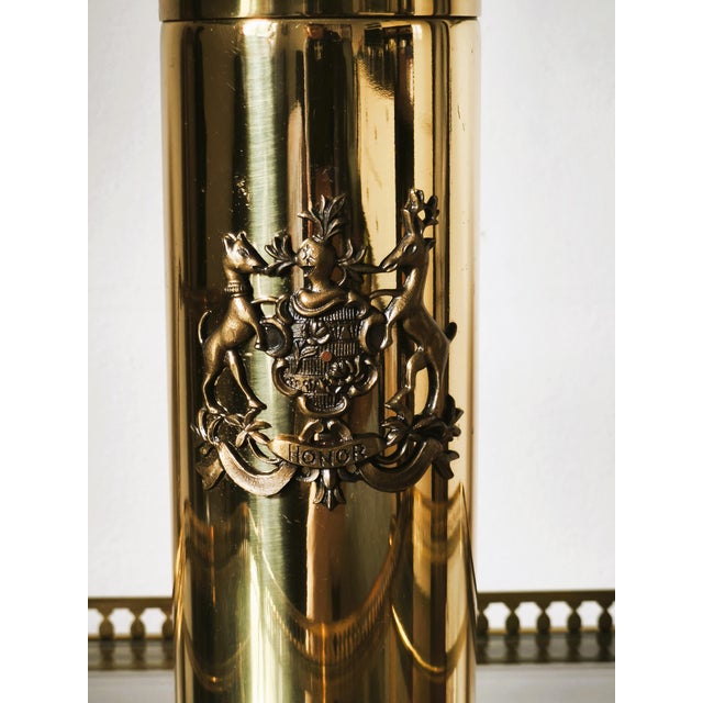 Mid-century Italian cocktail shaker in polished brass with a heraldic "HONOR" crest and a rosewood knob. Stainless steel...