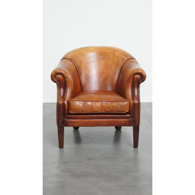 Offered this desirable sheep leather club chair with beautiful colors and comfortable seating. Not only for the person...