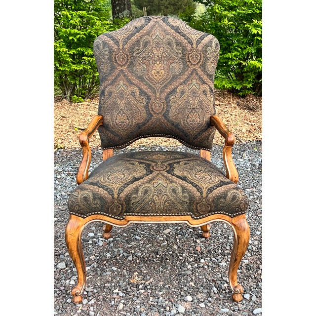 The Palazzo armchair. Inspired by classic Italian antiques with graceful carbtiolet legs, scalloped apron and sloped arms....