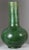 A large Chinese bottle shaped pottery vase with a wonderful monochrome green glaze. Measures 15" tall x 8.5" wide. Has an...