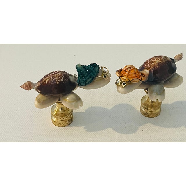 Super charming pair of handmade sea Shell Glorida turtles figurines mounted on brass bases as lamp finials.