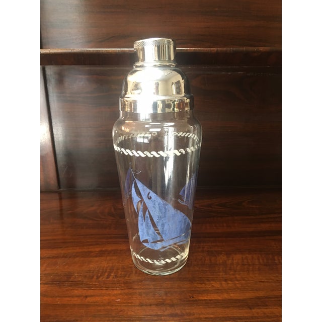 This whimsical large Art Deco cobbler-style cocktail shaker features a blue sailboat pattern over a clear glass tapered...