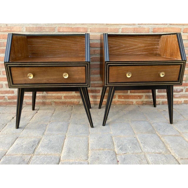 Elegant and stylized 1960s mid-century Italian nightstands, with clear glass, on top. You can see the refined details like...
