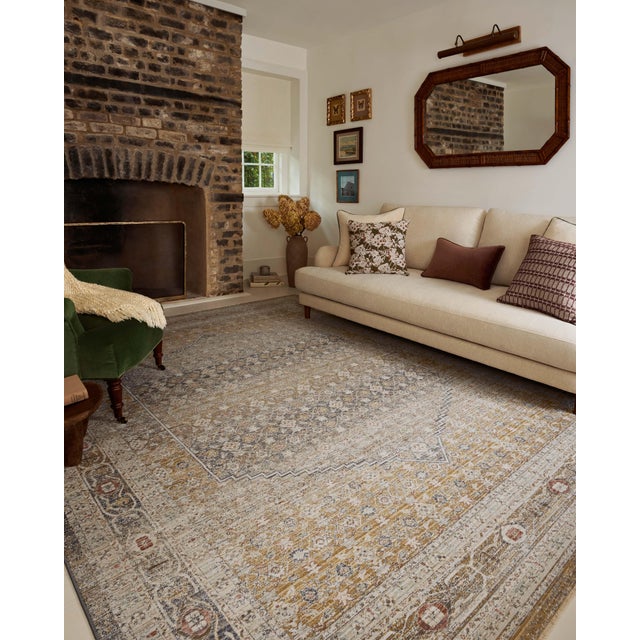 The Ida Collection from Chris Loves Julia x Loloi is a vintage-inspired area rug with a soft, subtly textured pile similar...