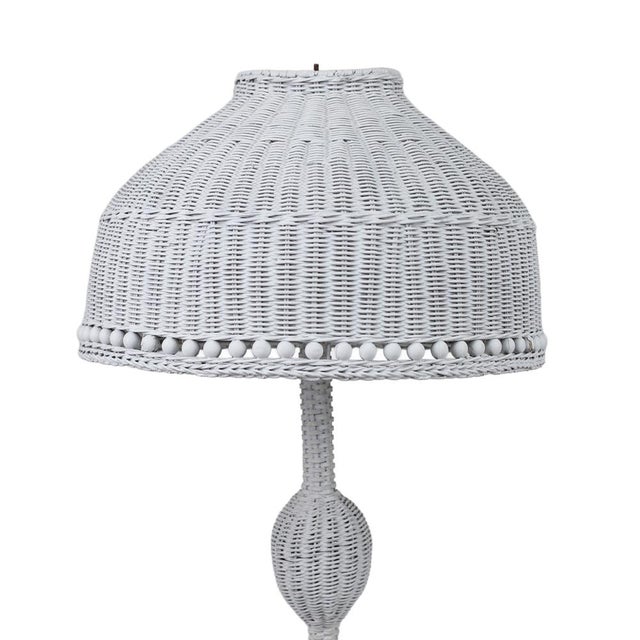 Early 20th century American white wicker lamp with woven shade.
