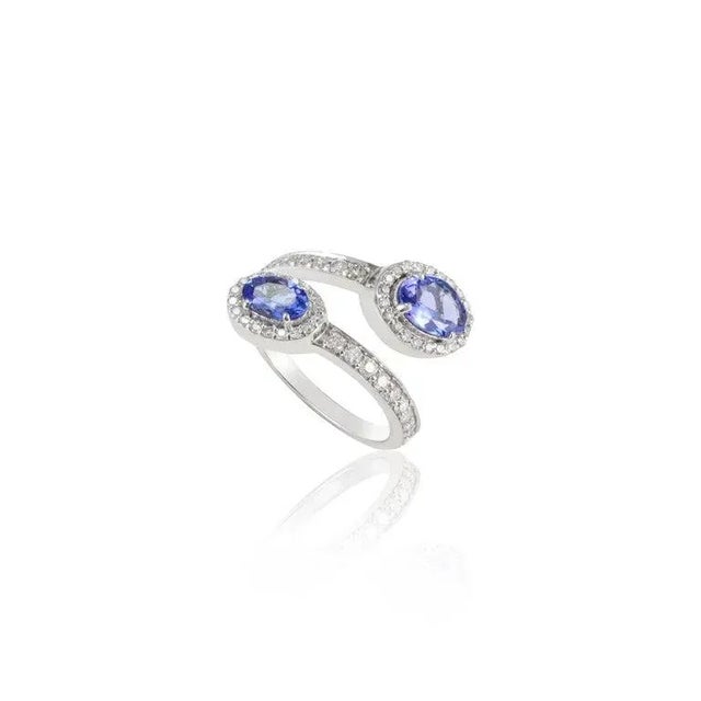 This is part of Chairish’s Fine Jewelry assortment. Genuine Oval Tanzanite and Halo Diamond Bypass Ring Set in 14K Gold...
