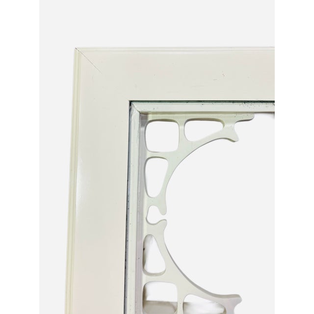 Palm beach style console table featuring lattice style legs and lovely fretwork. Inset glass top, original ivory/eggshell...