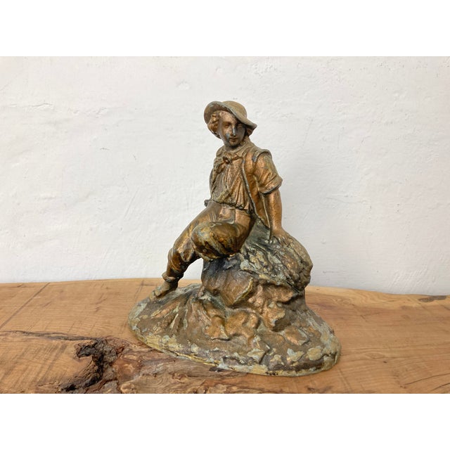 Wonderful late 19th-century antique gilded spelter material figurine with a copper finish featuring a majestic chap...