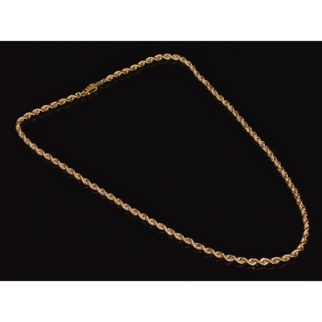 Top quality 14K yellow gold faceted rope chain necklace. This 18.5-inch designer chain by Michael Anthony features an...