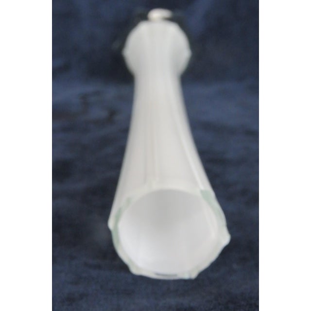 This Slim Tapered Vase is made of glass. It presents a wonderfully charming white color to the elongated neck of the...