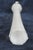 This Slim Tapered Vase is made of glass. It presents a wonderfully charming white color to the elongated neck of the...