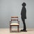Mahogany-stained beech armchair. Open back, curved armrests, turned legs with vertical grooves, removable padded seat....