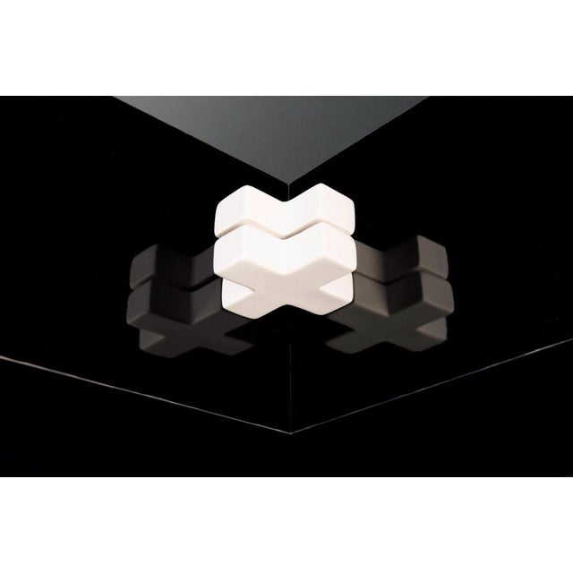 A hi-design sculptural work for the modern interior. Made wood, laminate, and porcelain, this minimalist sculpture by...