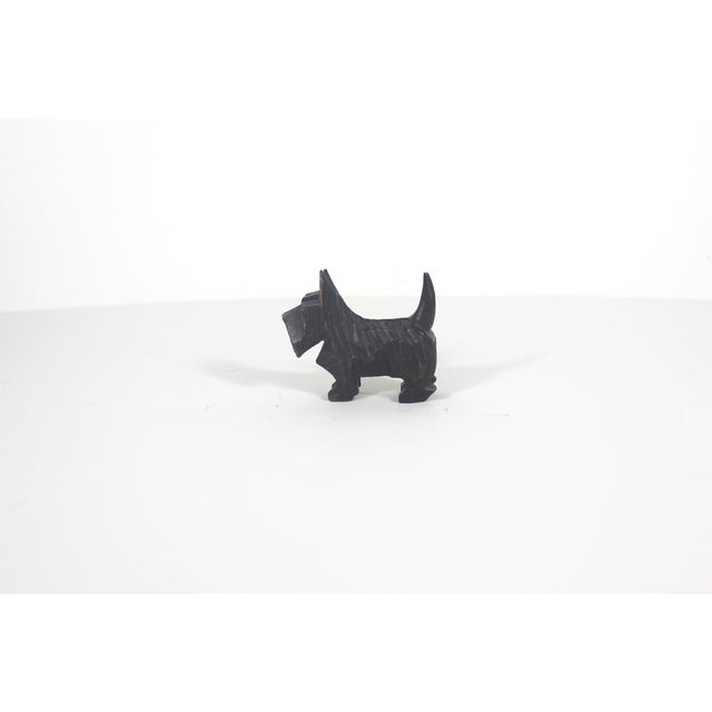 Vintage folk art hand carved wood Scottie dog figurine. In good vintage condition with some lovely vintage patina, as seen...