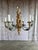 Exceptional early 19th-century in the style Italian Rococo chandelier, carved wood with wrought iron arms. This statement...