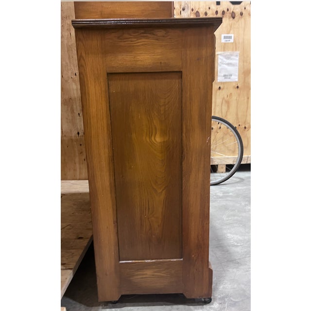 Oak with burl, original hardware. Pristine detailing and unique curvature.