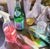 Bodegon by Yana Beylinson | Oil on board Still life with bottles and fruit on a table For Sale