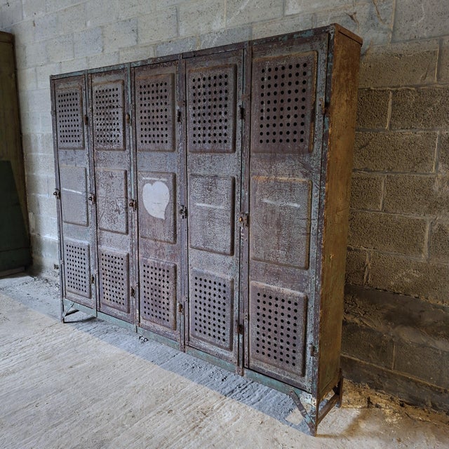This 5-door metal locker features a beautifully aged grey finish with subtle green and rust tones. A strong industrial...