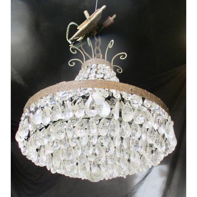 Crystal basket-form chandelier with a short link chain to a bronze canopy. Hold one Edison socket and bulb. The chandelier...