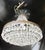 Crystal basket-form chandelier with a short link chain to a bronze canopy. Hold one Edison socket and bulb. The chandelier...