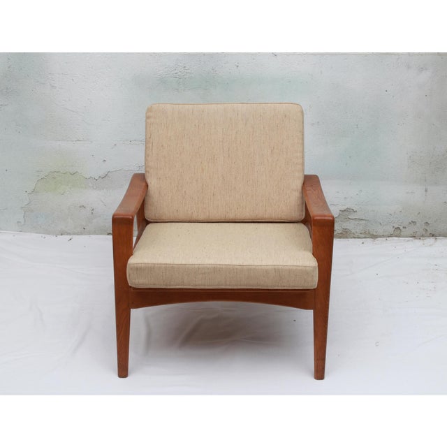 Design classic Made in Denmark: Armchair designed by Arne Wahl Iversen for ultimate comfort. Made of solid light oak. The...