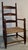 19thc childs wooden ladder back chair with cane seating. Wonderful dark brown patina color. This childs chair is strong...