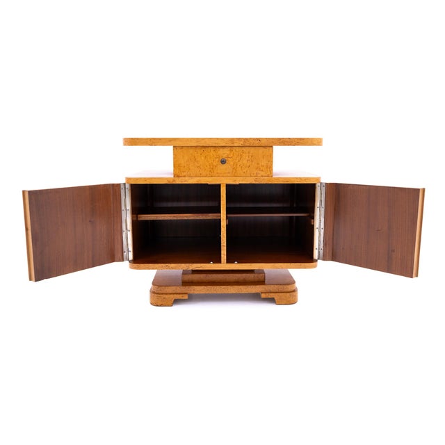 Unique art deco cabinet on a swivel base an exceptional art deco cabinet, distinguished by its geometric, streamlined form...