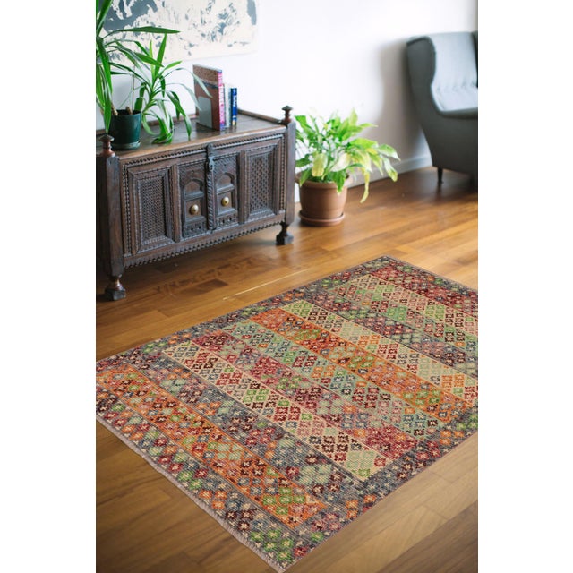A mesmerizing addition to any decor, this exhilarating hand-knotted rug featuring exquisite coloration in an intricate...