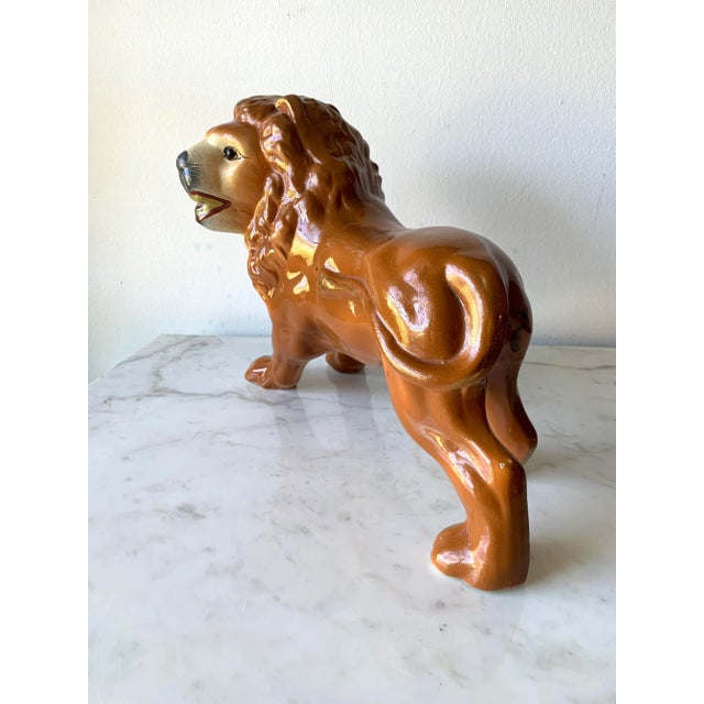 Behold the regal and imposing 19th Century Standing Lion Staffordshire Figure, a magnificent testament to the...